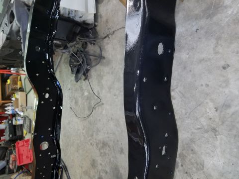 1996 Ford Bronco - Newly painted frame rails are ready for reassembly.