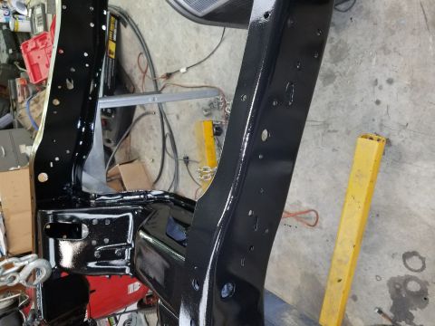1996 Ford Bronco - Close-up of a vehicle frame undergoing restoration or repair.