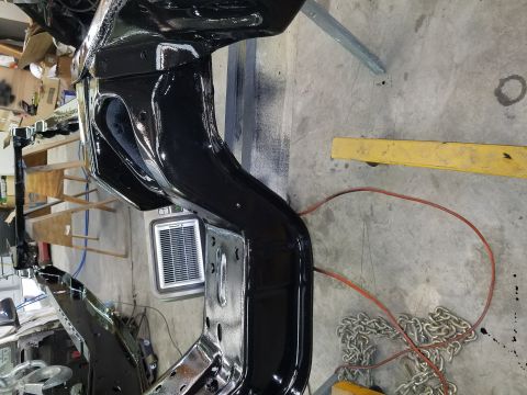 1996 Ford Bronco - Close-up of a freshly painted vehicle frame, likely undergoing restoration.