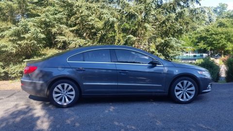 2010 Volkswagen Passat - This Volkswagen CC has a distinctive coupe-like profile and chrome trim along the lower body.