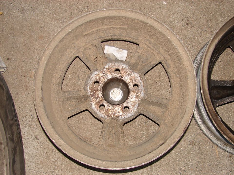Dusty five-spoke aluminum wheel