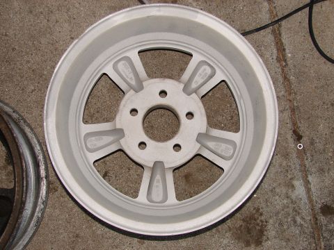 1973 Ford Ranchero - A single aftermarket aluminum wheel is shown, with another wheel partially visible to the left.