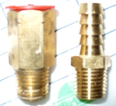 1992 Ford Bronco - Stayco radiator's tranny fitting on left, with mysterious female threads. 3/8" barb on right for PS cooler hookup, same 1/4" male threads.