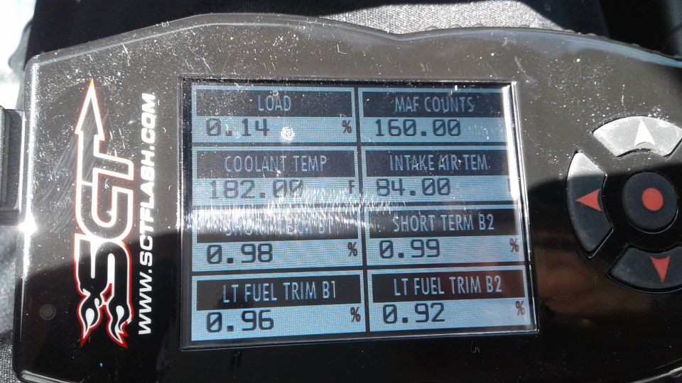 SCT Flash tuning device screen showing load, coolant temp, MAF counts, intake air temp, and fuel trims