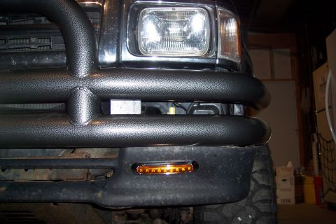 1993 Toyota Pickup/SR5 - Front view of a 1993 Toyota Pickup showing aftermarket bumper lights and brush guard.