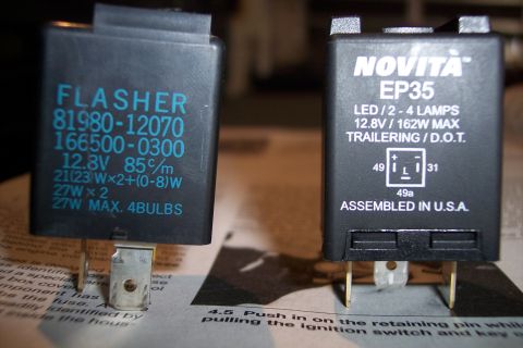 1993 Toyota Pickup/SR5 - Close-up of two electronic flasher relays, one with detailed specifications and the other a Novita EP35 model.