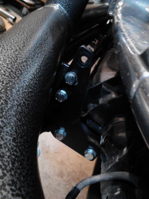 1993 Toyota Pickup/SR5 - Close-up of a vehicle's aftermarket tube bumper mounting bracket, showing bolted connections.