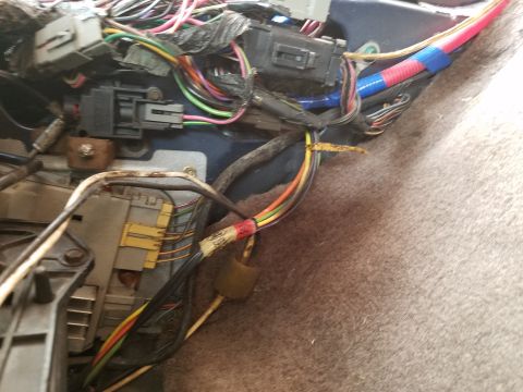 1994 Ford Bronco - A complex network of wires and connectors is visible within the vehicle's interior.