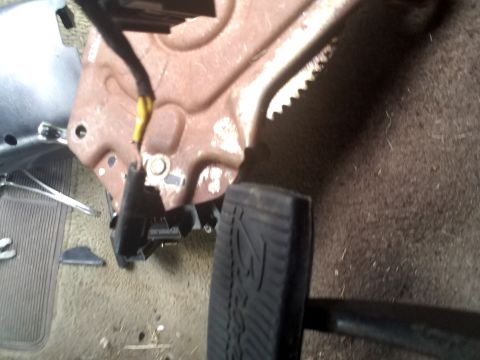 1994 Ford Bronco - Interior view of a vehicle's brake pedal assembly, showing worn components and wiring.