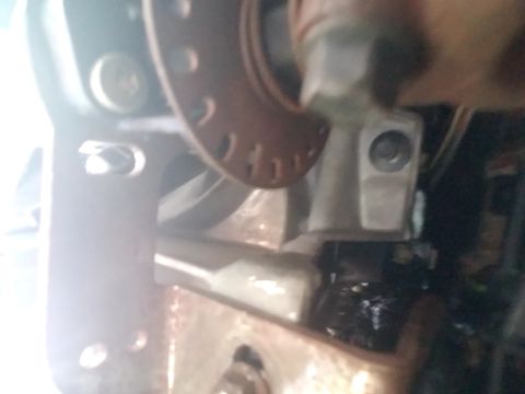 1994 Ford Bronco - Close-up view of an engine component with visible bolts and a circular flange.