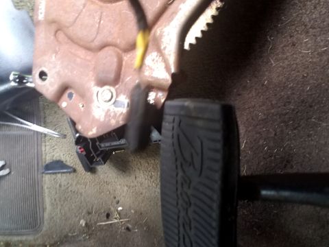 1994 Ford Bronco - Close-up view of the brake pedal and surrounding interior components.
