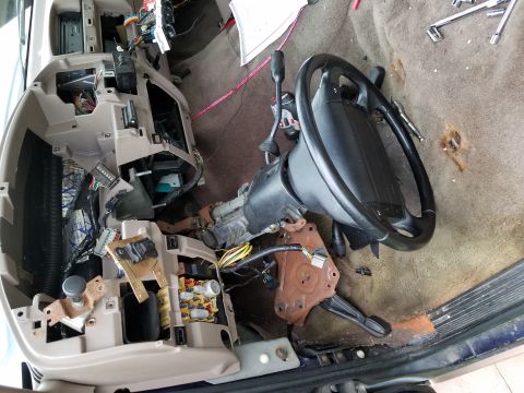 1994 Ford Bronco - The interior of a 1994 Ford Bronco is shown with the dashboard and steering column disassembled for repair or modification.