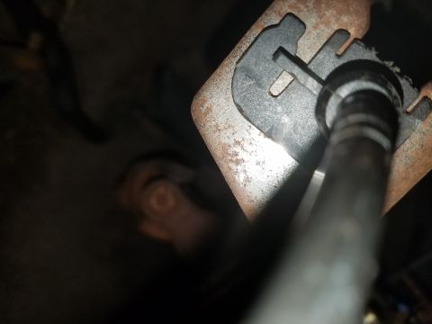 1994 Ford Bronco - A close-up view of a vehicle's interior mechanical part, showing rust and wear.