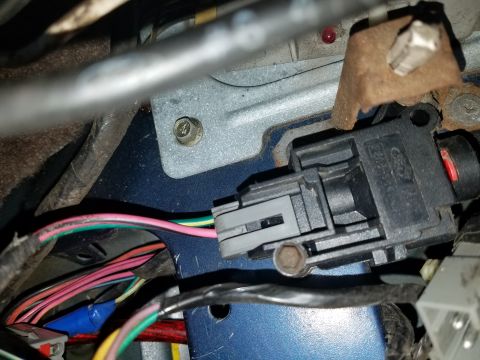 1994 Ford Bronco - Close-up of a Ford electrical connector and associated wiring, likely from a vehicle's interior.