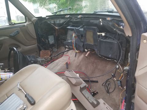 1994 Ford Bronco - Interior view of a 1994 Ford Bronco with the dashboard disassembled for repair or modification.