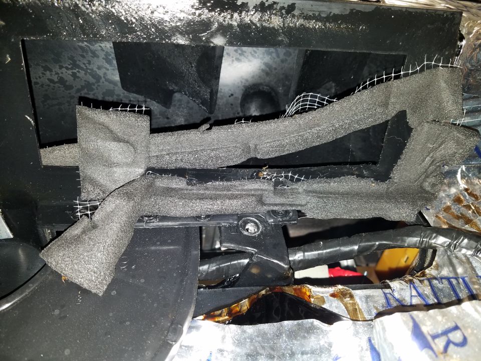 Dashboard interior with foam and mesh insulation, wires visible