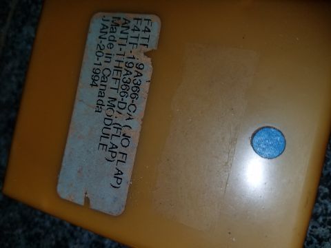 1994 Ford Bronco - Anti-theft module part with manufacturing date and part number visible on label.