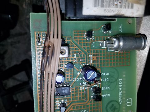 1994 Ford Bronco - A circuit board with various electronic components and a bundle of wires is shown in detail.
