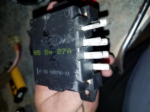 1994 Ford Bronco - A Ford electrical component is held in hand, showing part numbers and a date code.