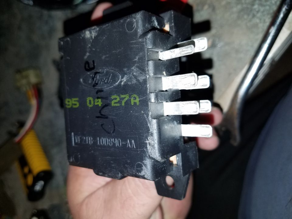 Ford electrical component with '95 04 27A' visible