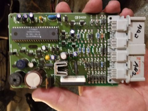 1994 Ford Bronco - Close-up of an electronic control module with visible components and connectors.