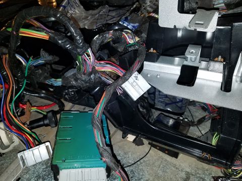 1994 Ford Bronco - Vehicle wiring harness and control module, likely from a dashboard or under-dash area.