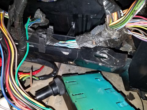 1994 Ford Bronco - A complex network of wires and an electronic module are visible in this close-up interior shot.
