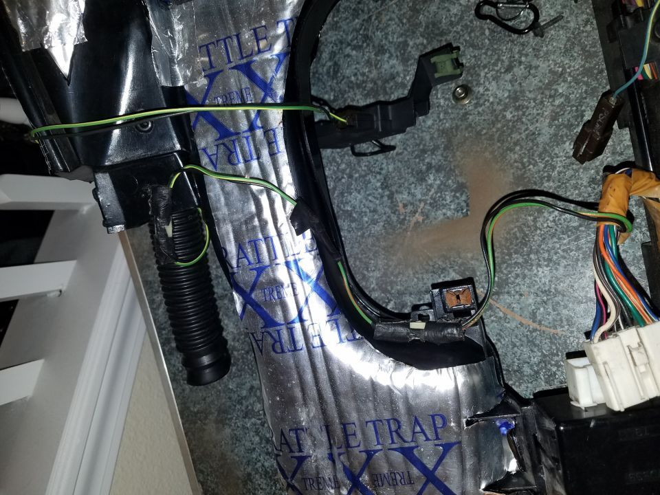 Vehicle interior wiring harness with sound deadening material and connectors