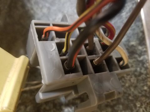 1994 Ford Bronco - Photograph of an automotive connector block with multiple color-coded wires, not a technical diagram.