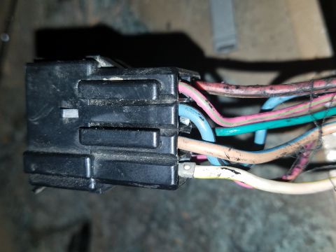 1994 Ford Bronco - Photograph of a black multi-pin electrical connector and wiring, not a diagram.