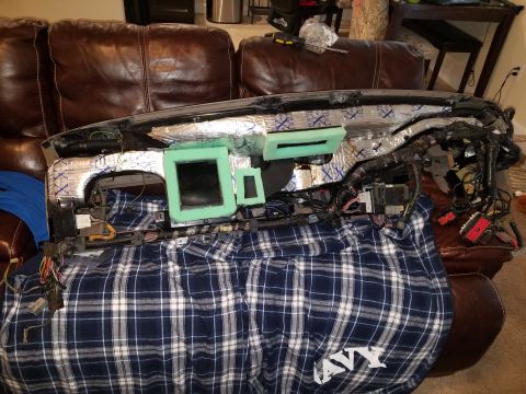 1994 Ford Bronco - Photograph of a removed dashboard with wiring harness and insulation, not a technical document.