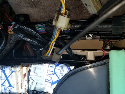1994 Ford Bronco - Photograph of underdash wiring and a multi-pin connector, not a technical document.
