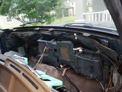 1994 Ford Bronco - Photograph of an exposed HVAC heater box and firewall during dash removal, not a technical document.