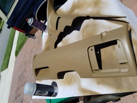 1994 Ford Bronco - Photograph of repainted tan lower dash trim panels, not a technical document.