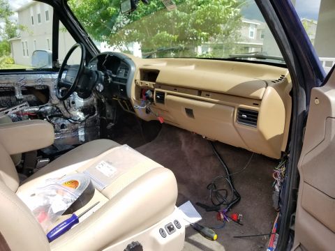 1994 Ford Bronco - Photograph of an installed tan dashboard in a truck cab interior, not a technical document.