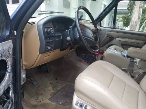 1994 Ford Bronco - Photograph of a truck cab interior with steering wheel and dash, not a technical document.