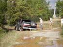 1989 Ford Bronco - This 1989 Ford Bronco is seen parked on a muddy dirt road, with its spare tire mounted on the rear.