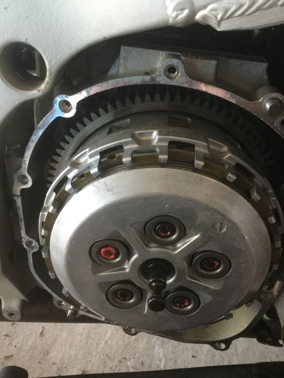 Motorcycle clutch assembly with visible plates and gears