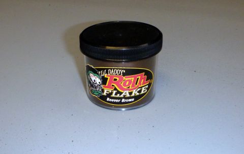 1962 MG B - A jar of Lil Daddy Roth Flake paint in Beaver Brown is shown on a flat surface.