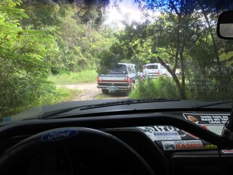 1989 Ford Bronco - The dashboard shows a Ford logo and several stickers, including one with a man's face and text.
