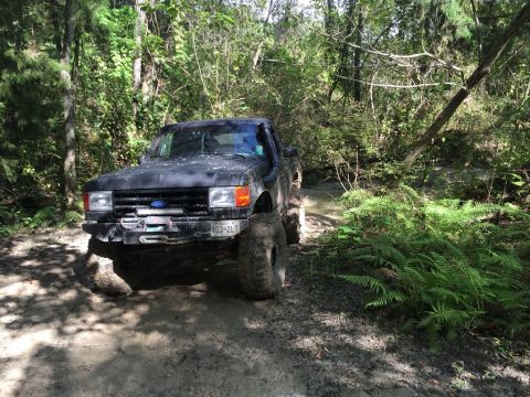 1989 Ford Bronco - This 1989 Ford Bronco navigates a challenging muddy off-road course.