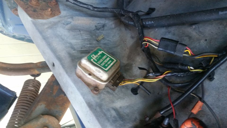 Green electronic module with "SOLID STATE ELECTRONIC" text and attached wiring harness