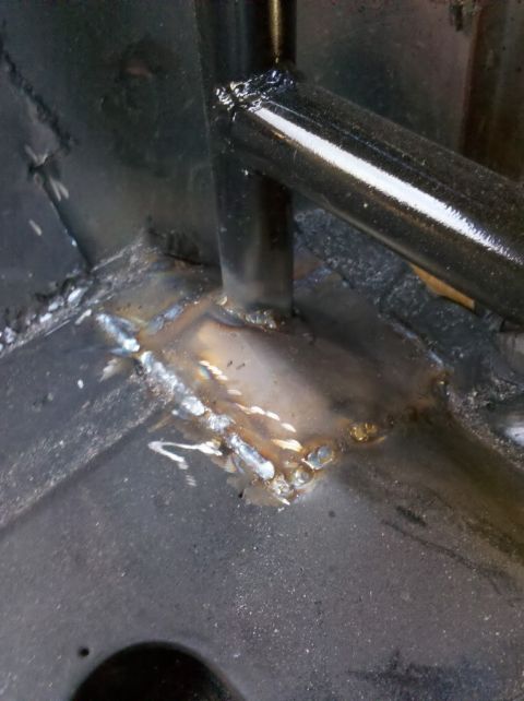 1989 Ford Bronco - Close-up of a welded metal structure, possibly part of a vehicle's interior frame.