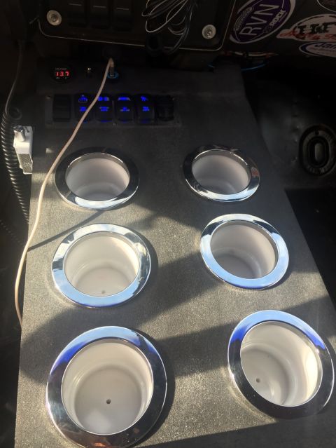 1989 Ford Bronco - This custom console features six cup holders, multiple auxiliary switches, and a digital voltage display.