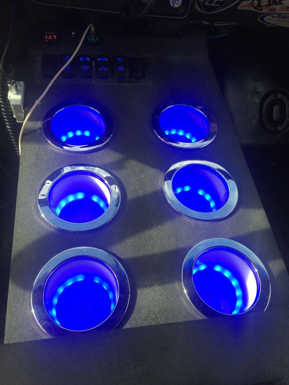Custom center console with six blue LED cup holders and a digital display showing '13.7'