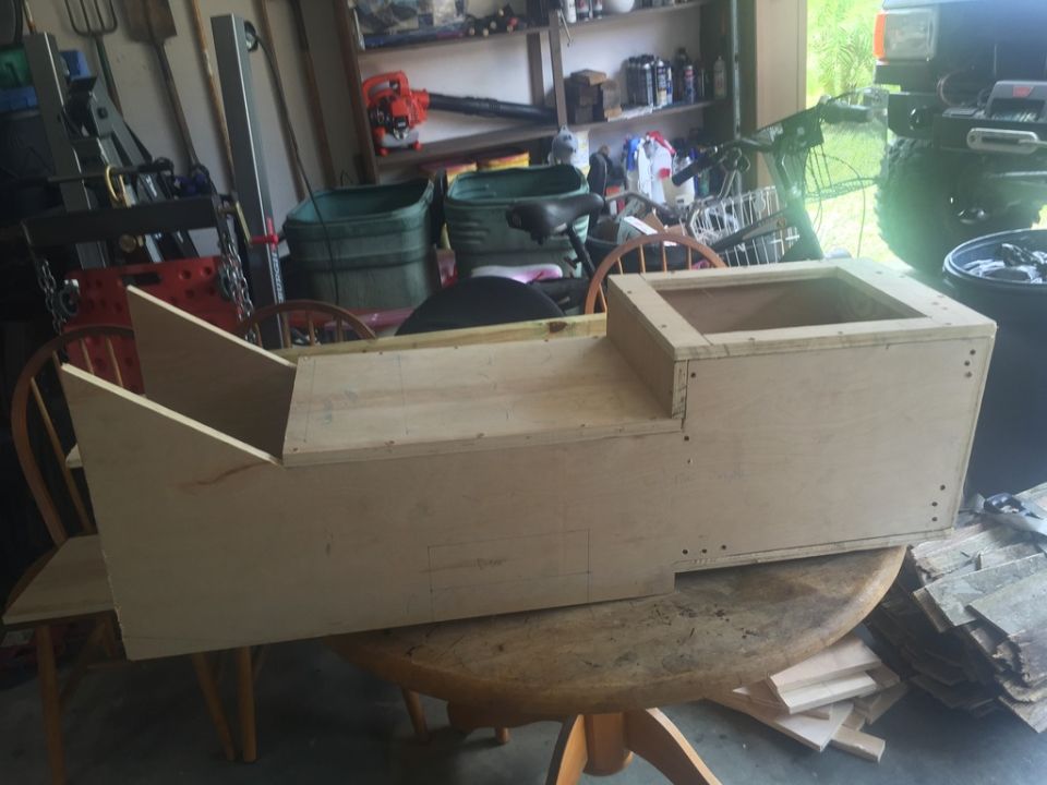 Wooden center console under construction on a table