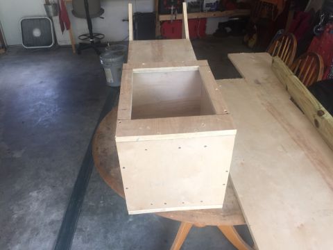 1989 Ford Bronco - Wooden box construction project in a garage setting.