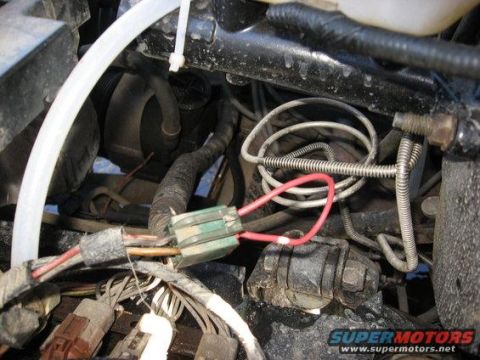 1989 Ford Bronco - Engine wiring harness detail with fuse box and red wire visible.