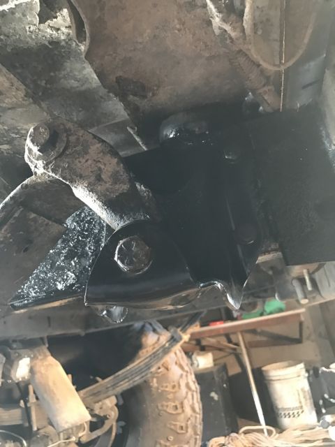 1989 Ford Bronco - Close-up view of suspension components, focusing on the leaf shackle attachment point.