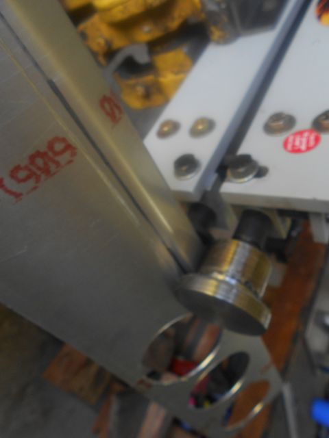 1992 Ford Bronco - Close-up of a metal bracket with red markings, possibly from a workshop or fabrication project.